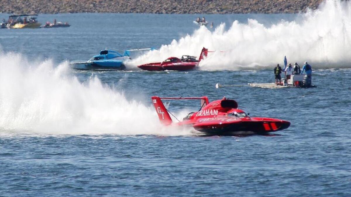 J. Michael Kelly in the U-12 Graham Trucking unlimited hydroplane races to a Columbia Cup championship Sunday on the Columbia River. Jimmy King in The U-3 Grigg’s Presents the Miss Ace Hardware battles for second place against Jimmy Shane, left, in the U-1 HomeStreet Bank behind the race leader