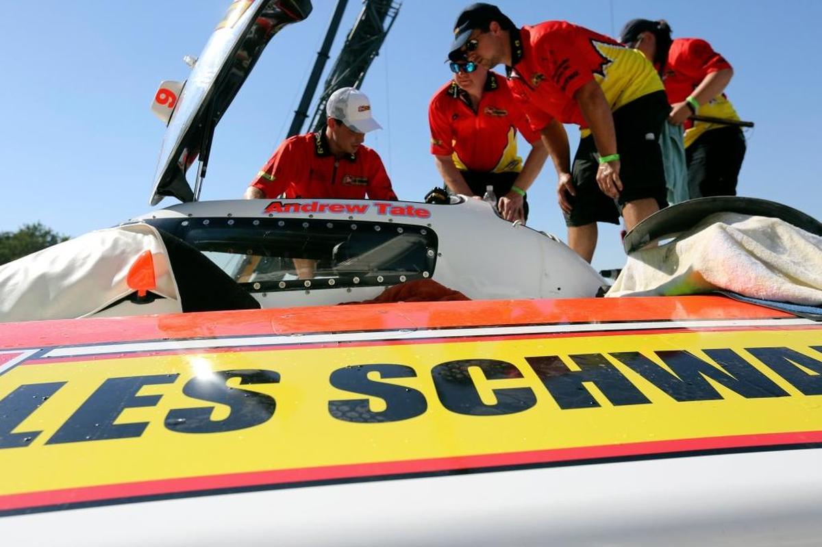 Andrew Tate, center, talks with a member of the crew as they work on the U-9 Gale-Rew Construction presents Les Schwab Tire hydroplane during qualifying at the 2016 HAPO Columbia Cup. The U-9 is sponsored by Delta Gear and Realtrac ERP this season.
