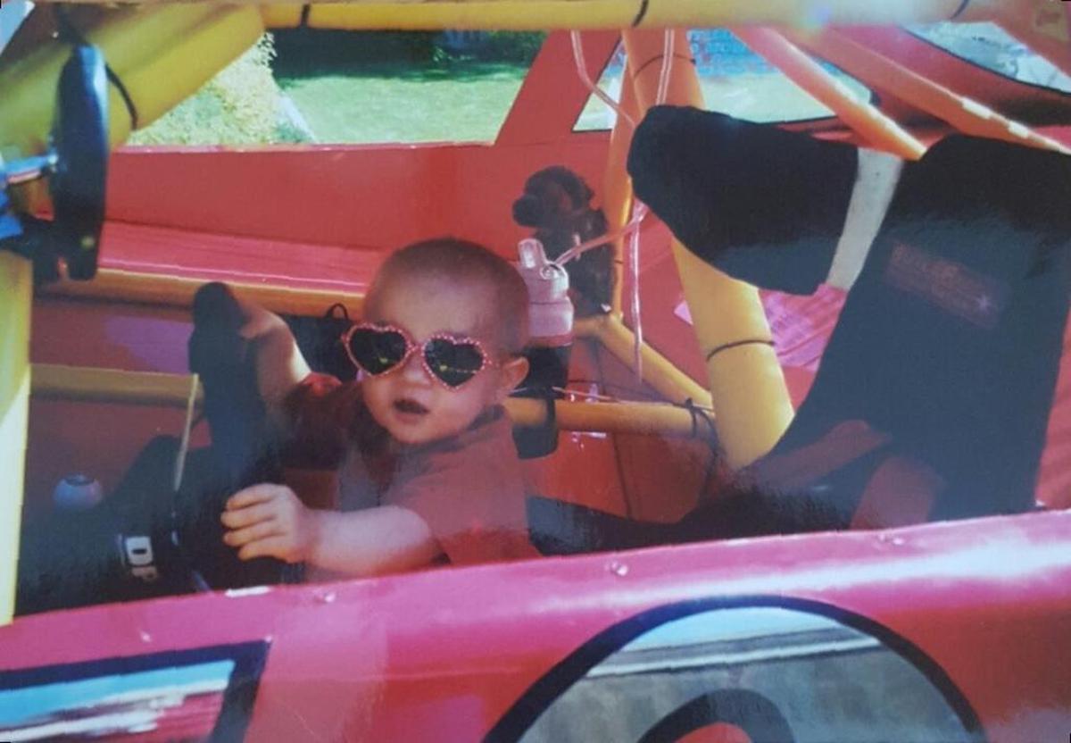 A young Brittney Zamora ‘test driving’ her dad Mike’s car. Just 15 years later, she’s behind the wheel of a stock car and forging her own path on the track.