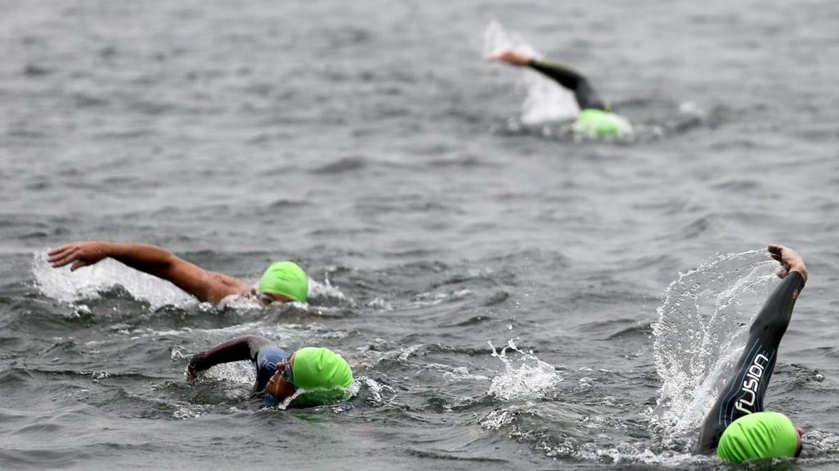 
Athletes swim in the Columbia River while competing in the Titanium Man Triathlon on Saturday at Columbia Park in Kennewick. The race included a 1.5-kilometer swim, a 42K bike ride and a 10K run. 
