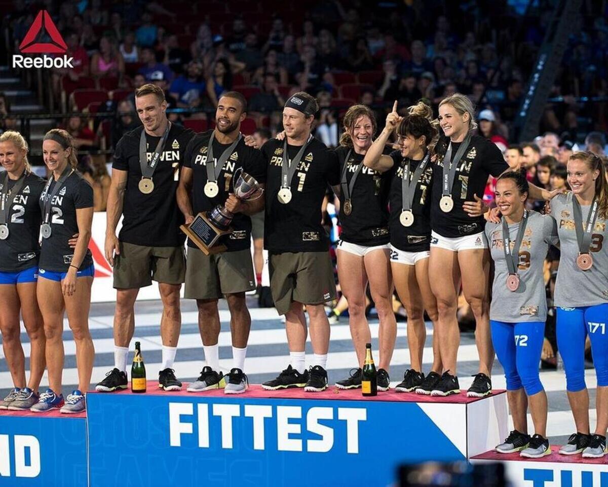 The Wasatch CrossFit team of Brennan Fjord (from left), Adrian Conway, Mitch Spjut, Mandi Janowitz, Tiffany Hendrickson and Michaela North celebrate their win at the Reebok CrossFit Games on Aug. 6 in Madison, Wisc.