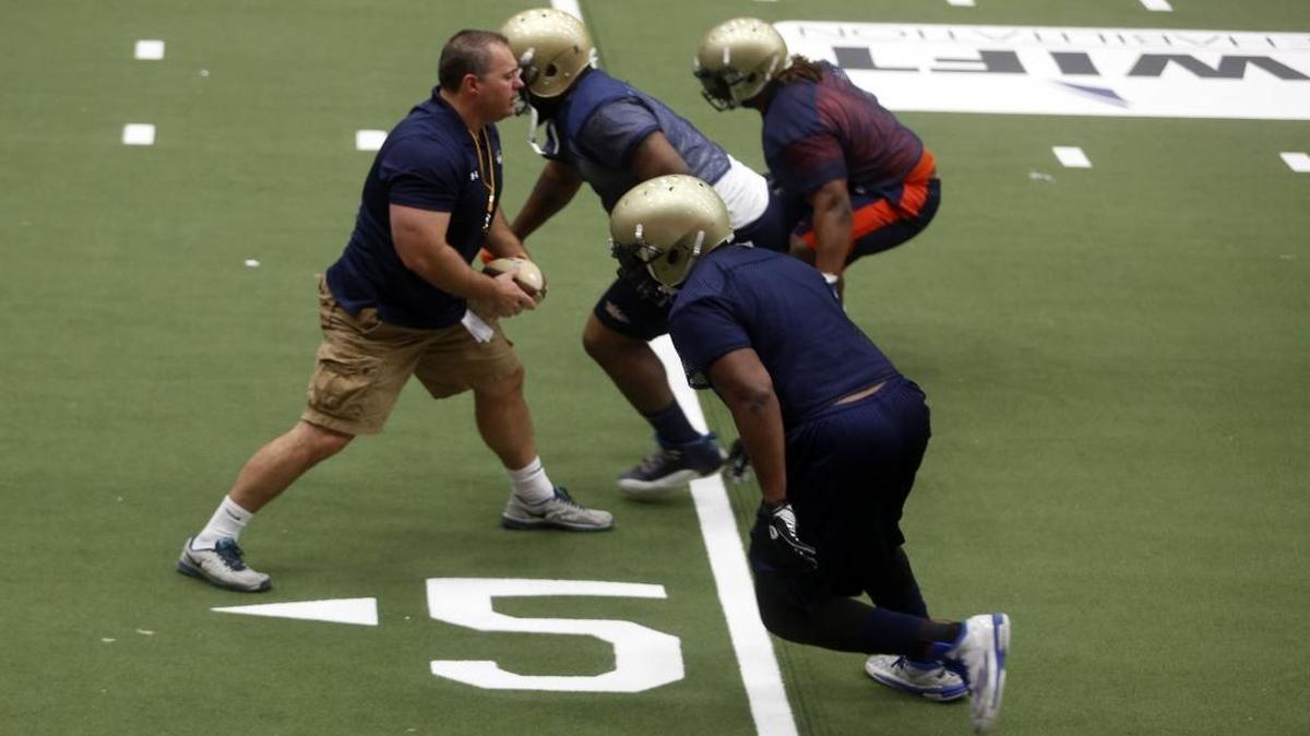New Tri-Cities Fever head coach Ryan Lingenfelder works with players on a drill Thursday during practice at the Toyota Center in Kennewick. They begin the season at 7:05 p.m. Saturday against the visiting Spokane Empire.