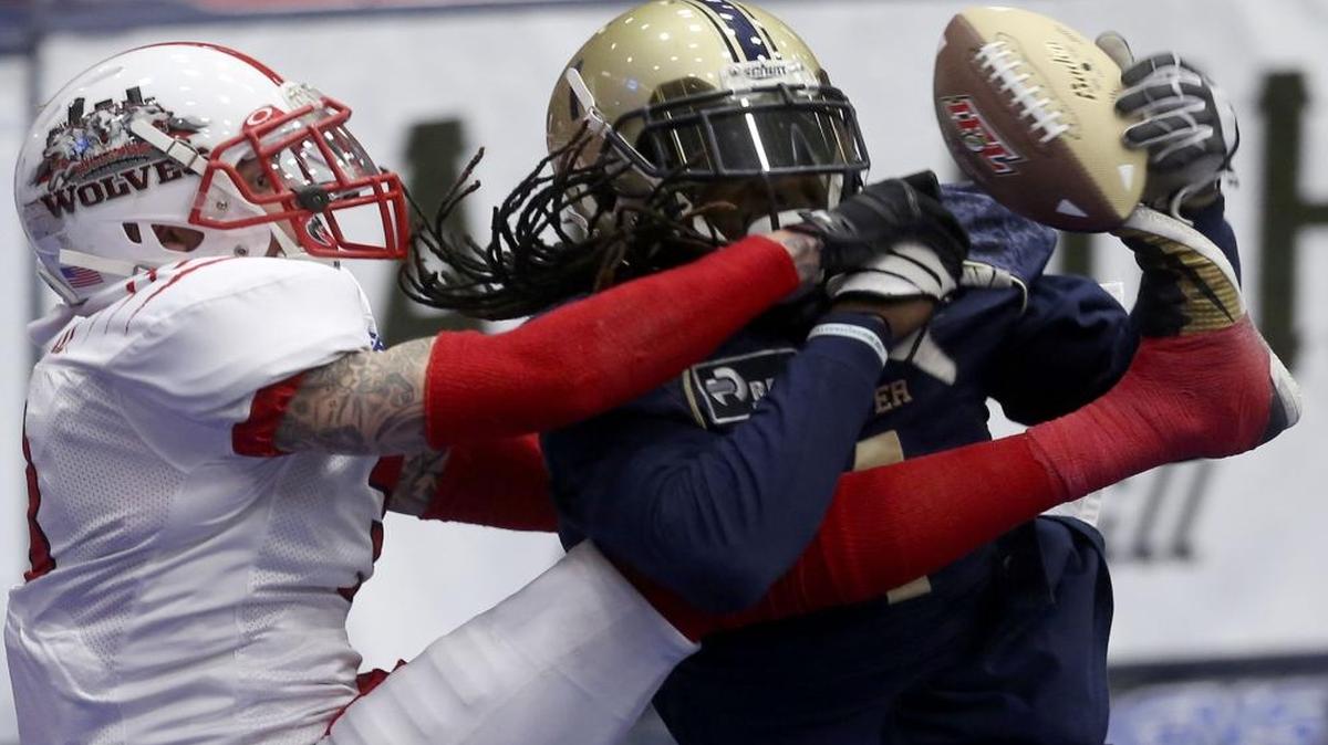 Billings’ Norris Wrenn, left, uses his foot to break up and then intercept a pass to Tri Cities receiver DeJay Lester during Saturday’s game at the Toyota Center. See more photos at www.tricityherald.com.