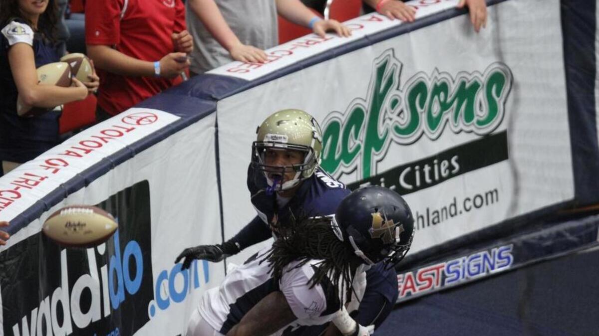 Tri-Cities Fever defensive back Lionel Singleton keeps his eyes on the ball after breaking up a pass play in the Wyoming end zone during this April 27, 2013 game. Singleton was inducted into the IFL Hall of Fame on Thursday.