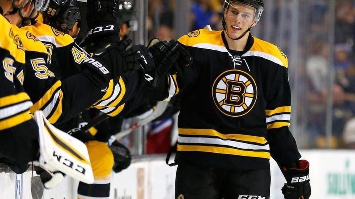 Brandon Carlo celebrates with his Boston Bruins teammates after he scored a goal in preseason action.