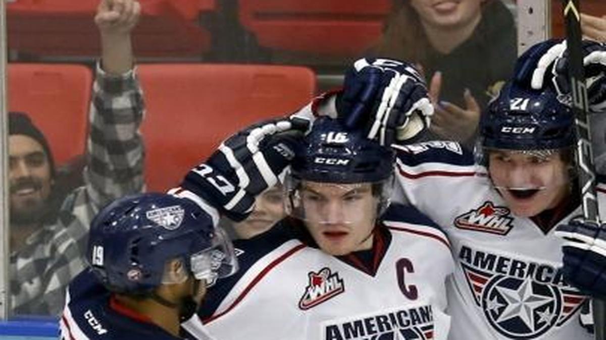 Tri-City Americans celebrate a goal from Vladislav Lunk (21) over the Vancouver Giants Tuesday during a game at the Toyota Center. See more photos at www.tricityherald.com.