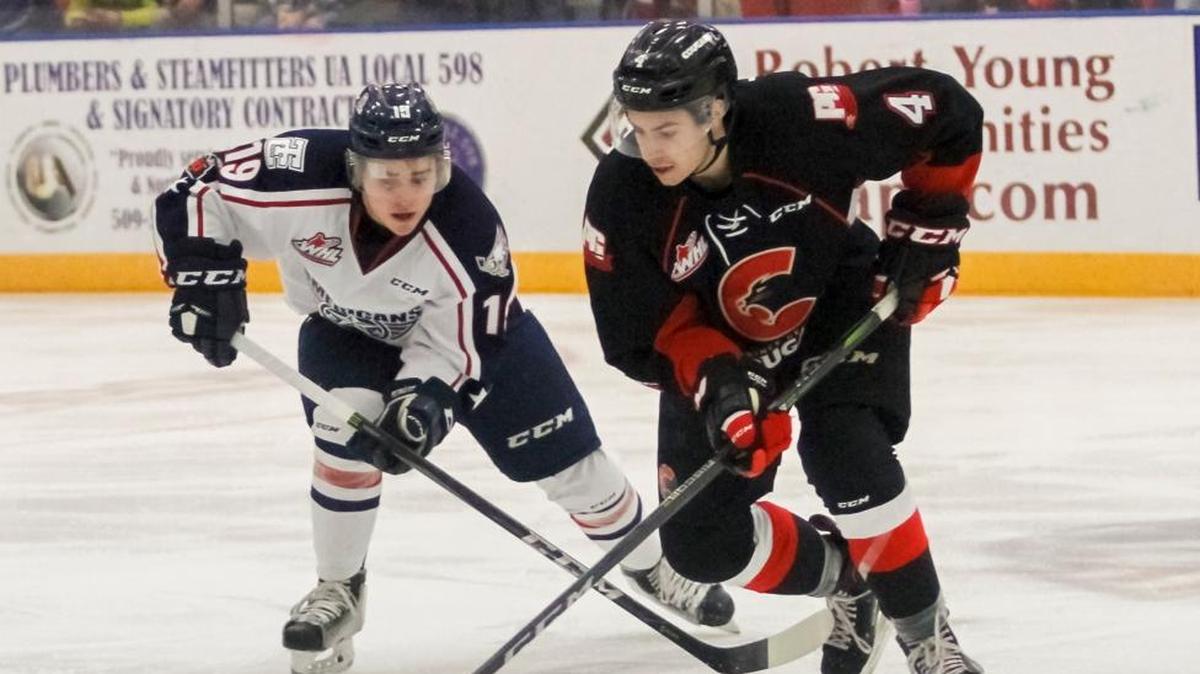 Tri-City’s Connor Bouchard left, attempts to steal the puck from Prince George’s Joel Lakusta during Saturday’s game at Toyota Center in Kennewick.