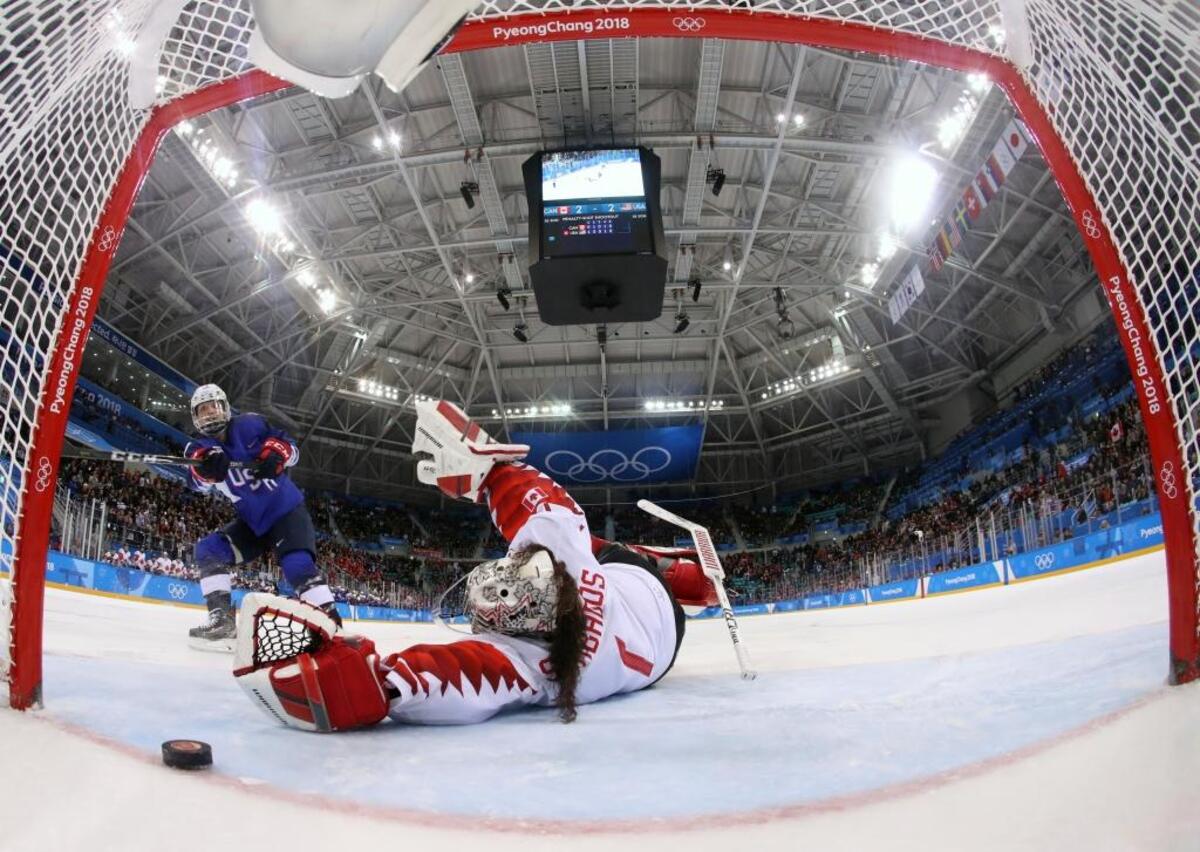 Jocelyne Lamoureux-Davidson of the United States, scores the game-winning goal against Canadian goalie Shannon Szabados in the penalty shootout during Thursday’s gold medal game at the 2018 Winter Olympics in Gangneung, South Korea.