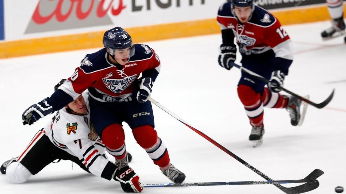 Tri-City’s Dylan Coghlan (10) and Portland’s Paul Bittner (7) reach for the puck during a game at Toyota Center in Kennewick. Coghlan hopes to hear his named called during this weekend’s NHL Draft.
