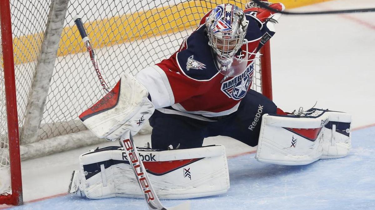 Former Tri-City Americans goalie Eric Comrie, attempting to make a save against the Kelowna Rockets during the 2014-15 season, was named to Team Canada for the IIHF World Championships. Comrie now plays in the NHL for the Winnipeg Jets.