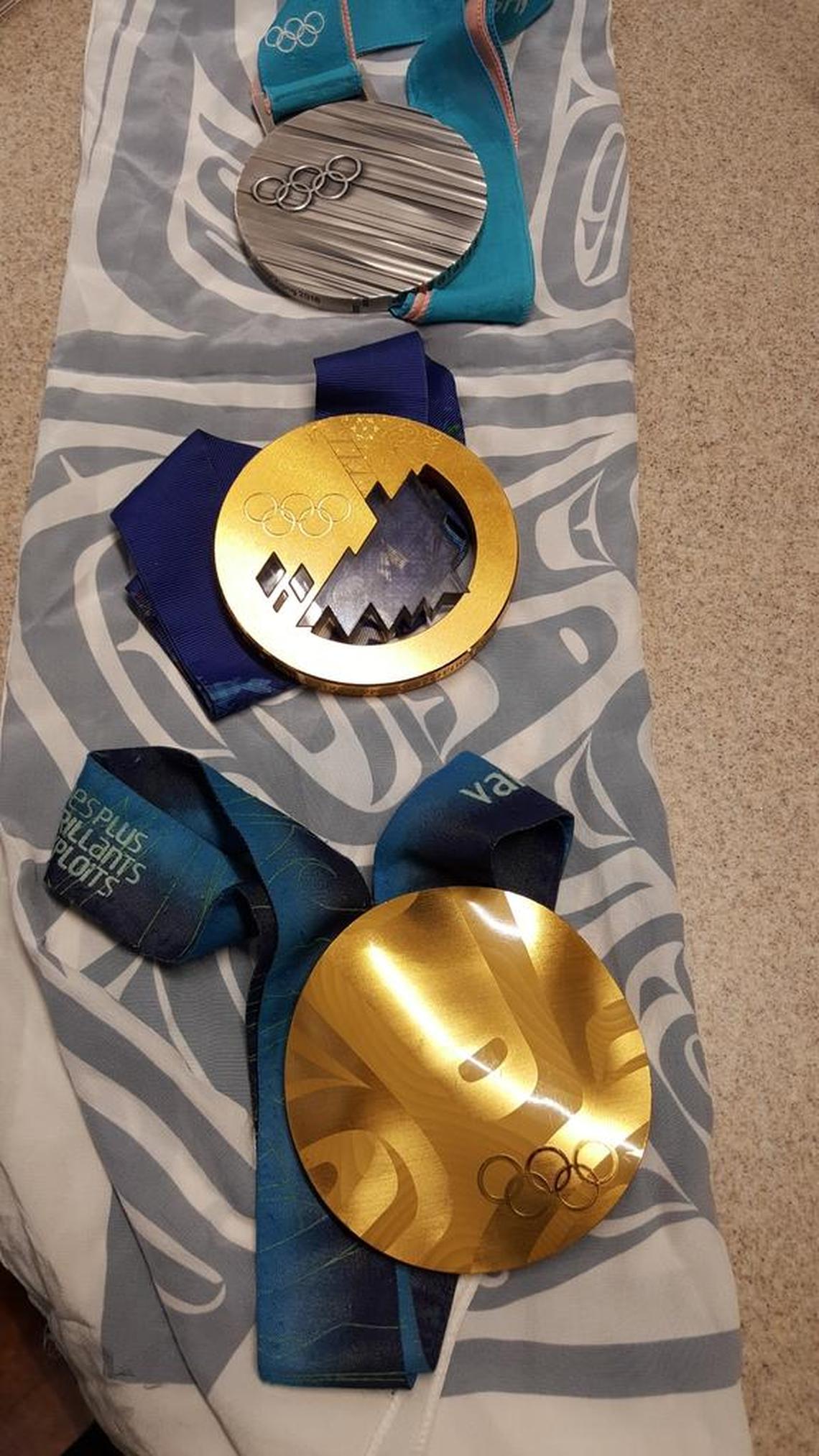 Shannon Szabados’ Olympics medals, from top, silver from Pyeongchang, gold from Sochi and gold from Vancouver.