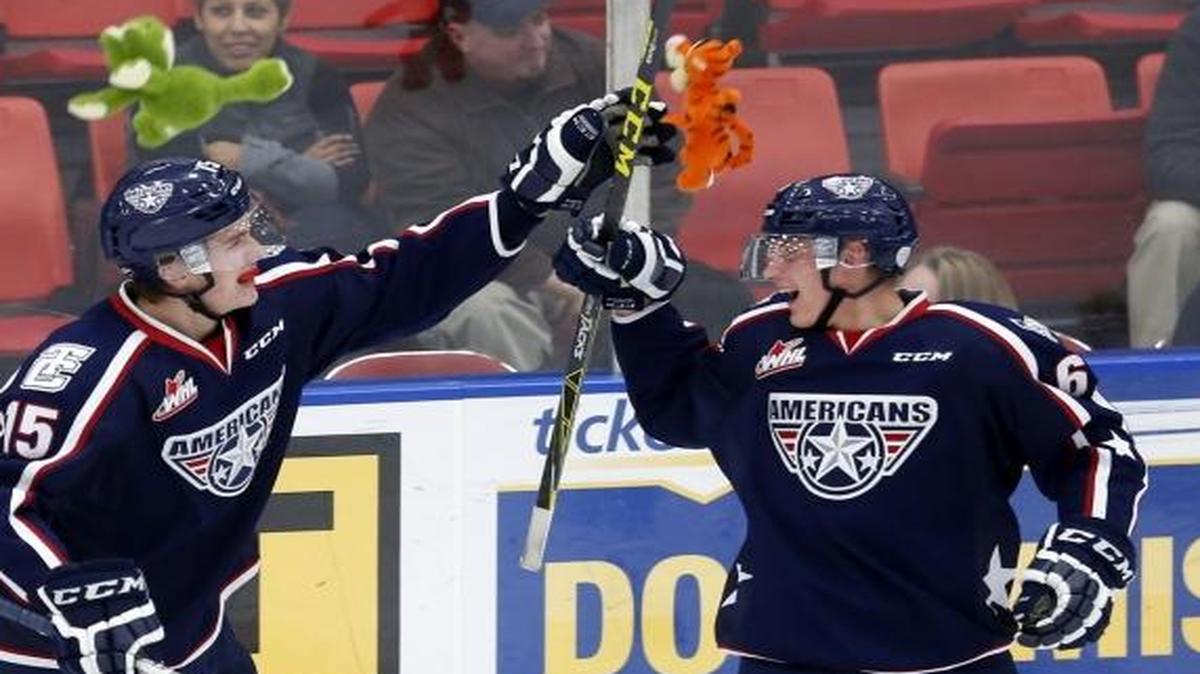 Tri-City’s Jusso Valimaki (6) and Michael Rasmussen (15) celebrate the first goal of the game Saturday against the Everett Silvertips as teddy bears are thrown onto the ice at Toyota Center in Kennewick.
