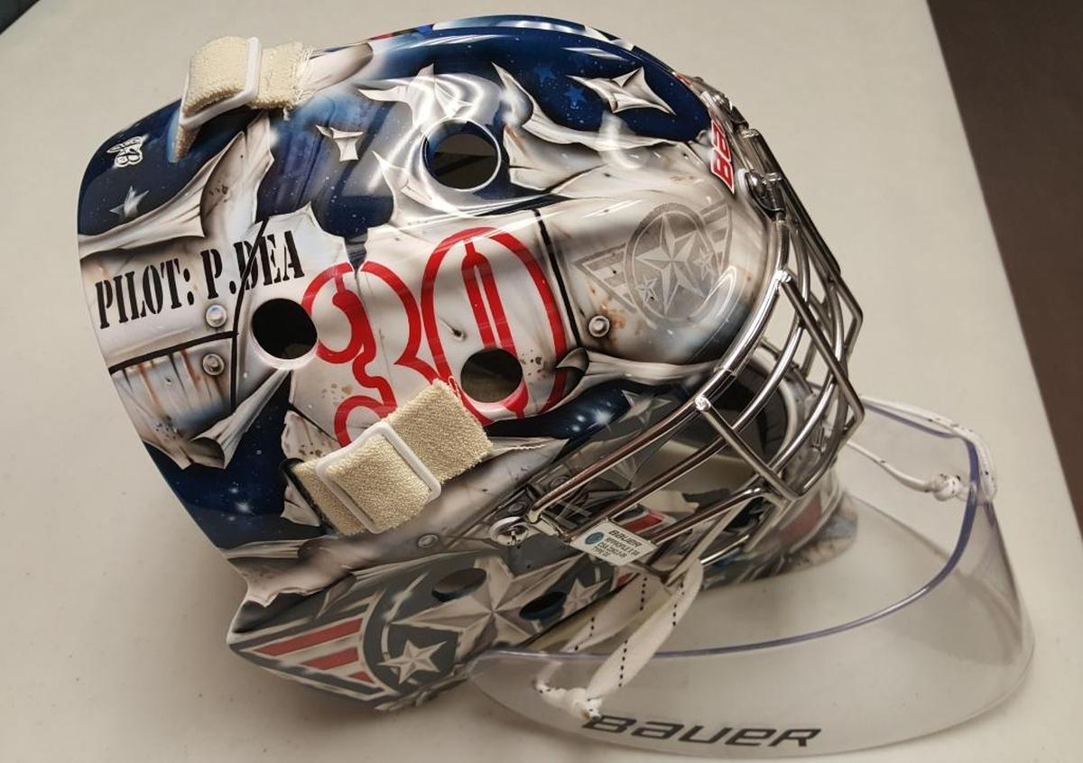 The right side of Patrick Dea’s goalie mask celebrates the Tri-City Americans’ 30th season and his favorite movie “Top Gun.”
