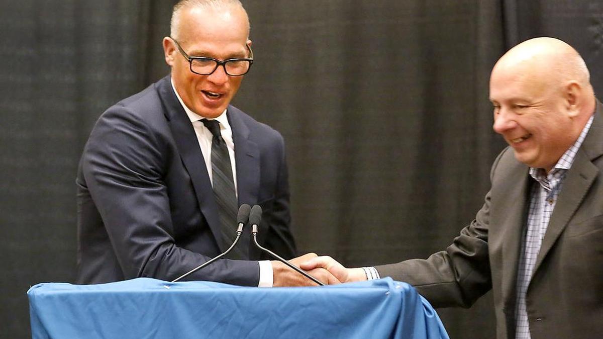 Kelly Buchberger and Tri-City Americans General Manager Bob Tory during the new coach’s introduction to the Tri-Cities in July. Buchberger and the Ams open the season Saturday night at home against Spokane.