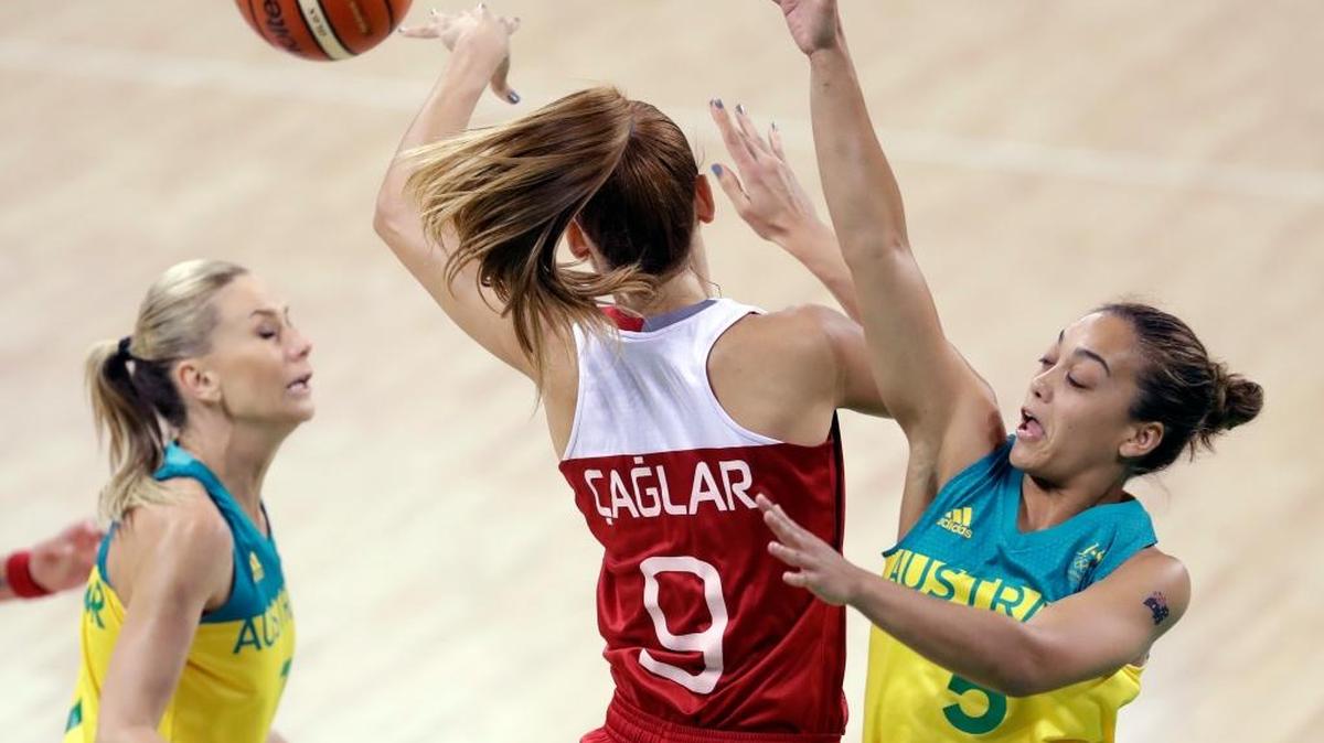 Turkey forward Bahar Caglar (9) passes the ball before running into Australia guard Leilani Mitchell, right, during their Olympic group-play game Sunday in Rio de Janeiro. Mitchell is a former Kennewick High School standout.