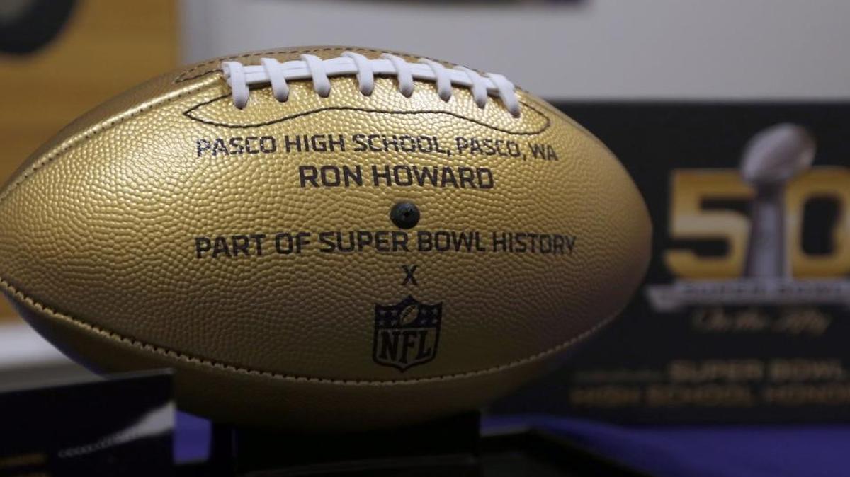 Pasco High School’s golden footballs for graduates Anthony Davis and Ron Howard.