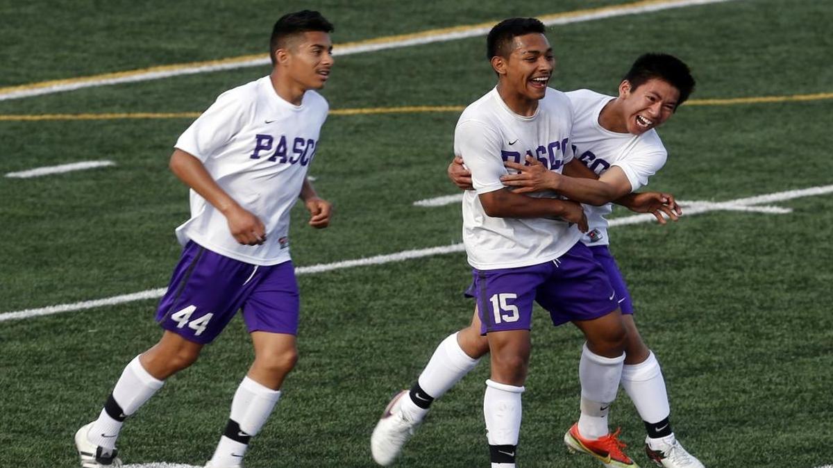 Pasco High School’s Jesus Meraz-Rodriguez (15) is congratulated by teammates Alex Kirk and Edwin Aquino (44) after scoring a goal on Mt. Rainier High School during the first round of the Class 4A state tournament Tuesday at Edgar Brown Memorial Stadium in Pasco.